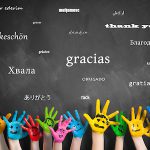 painted kids hands with the message “thank you” in many languages