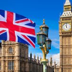 British flag, Big Ben and Houses of Parliament. London